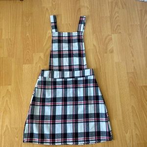 Black, red, and white plaid apron dress